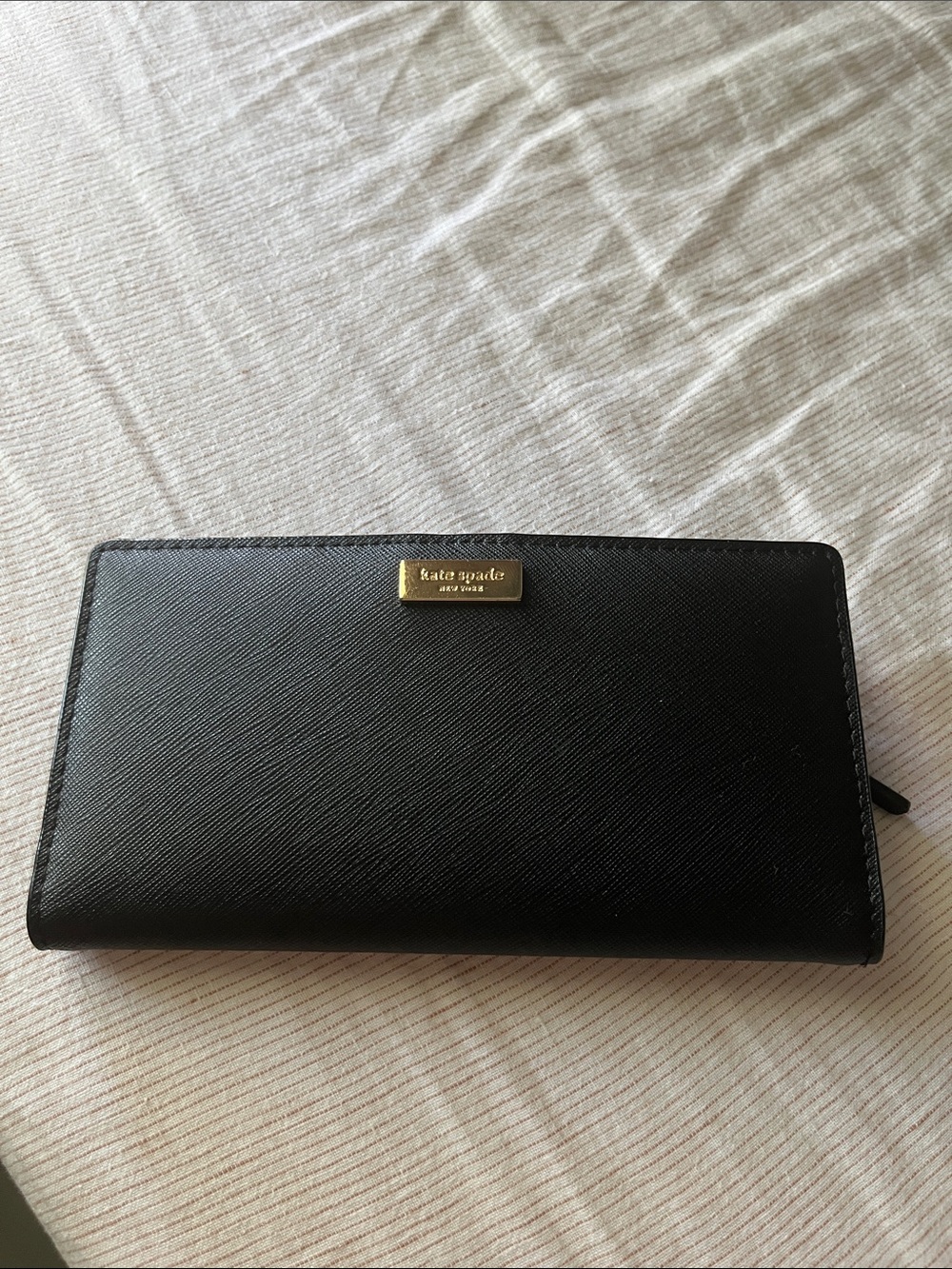 kate spade black leather zip-around wallet with gold logo